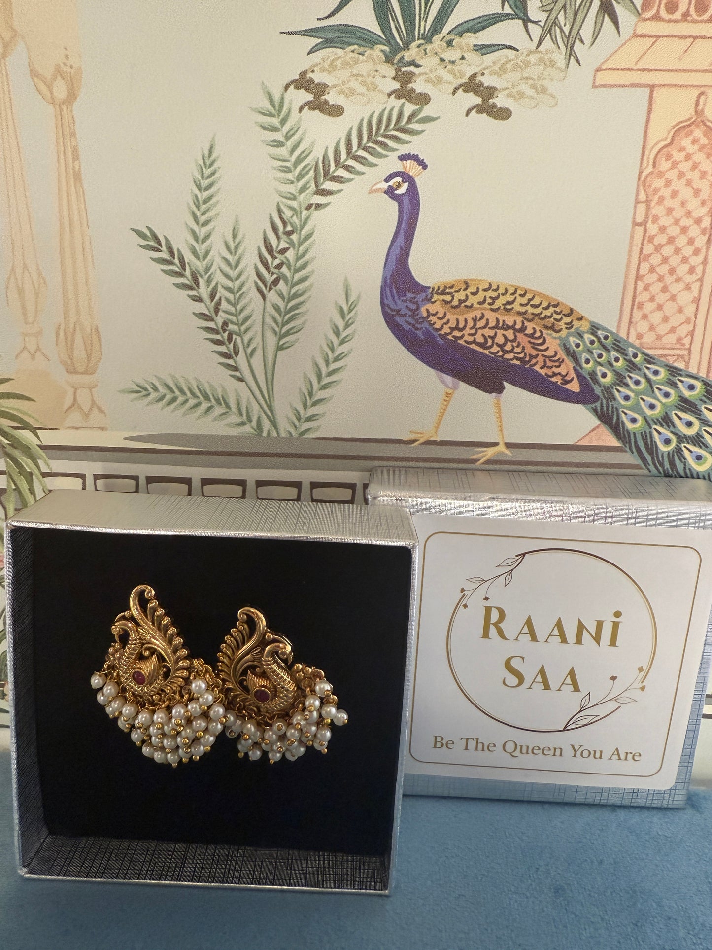 Hansini - swan pearl earrings
