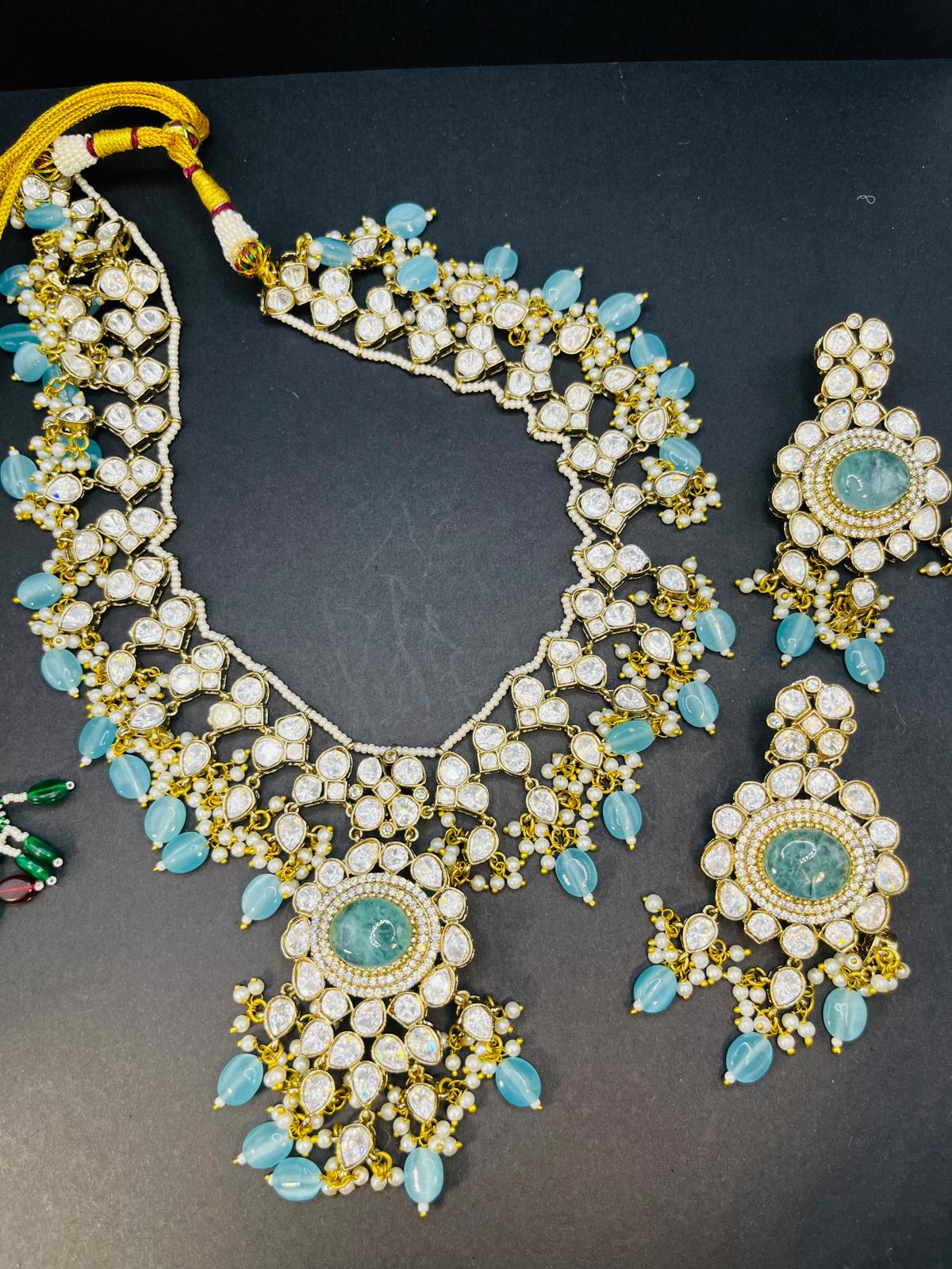 Abhika- Moissanite polki and real blue stone