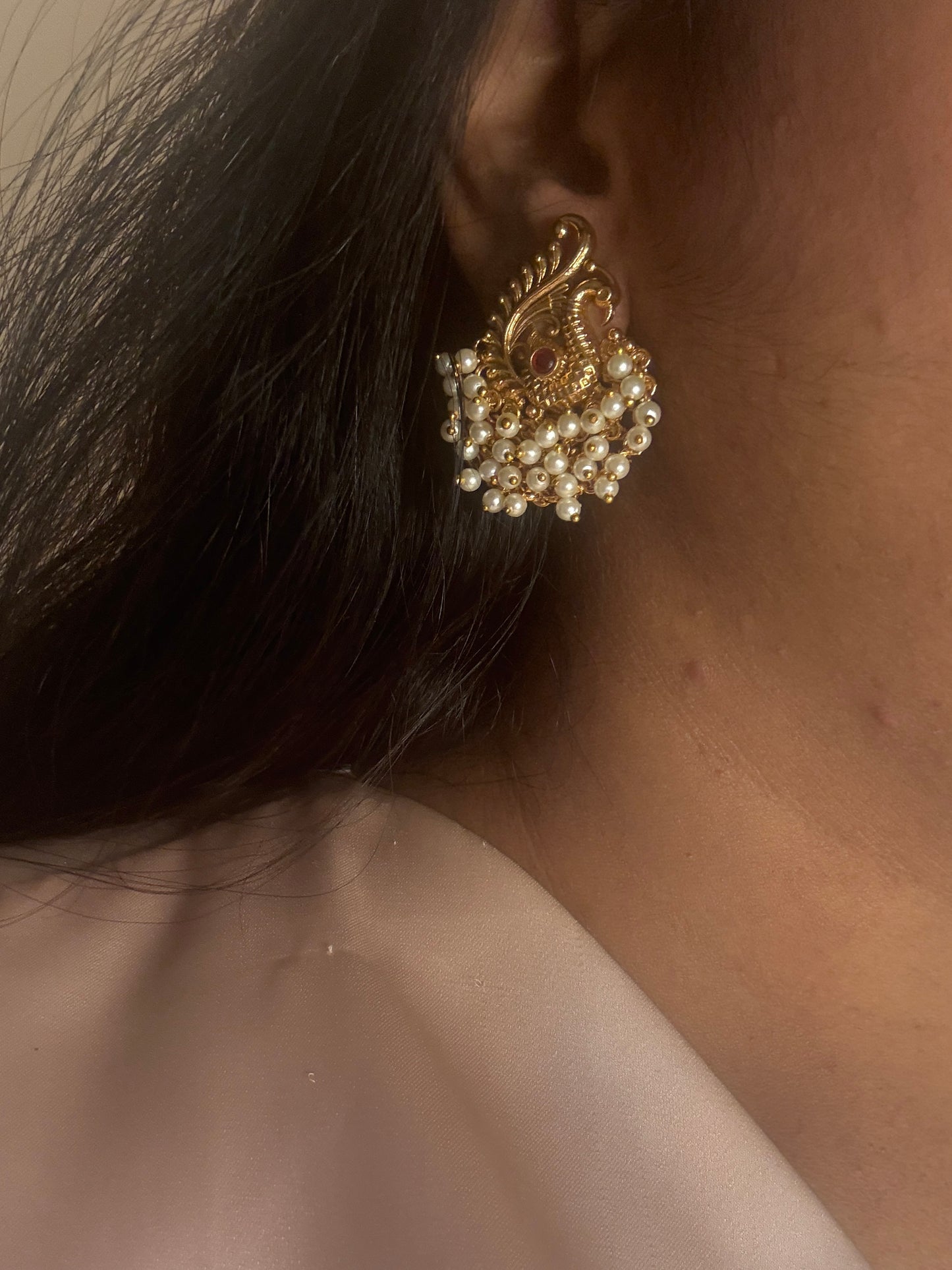 Hansini - swan pearl earrings