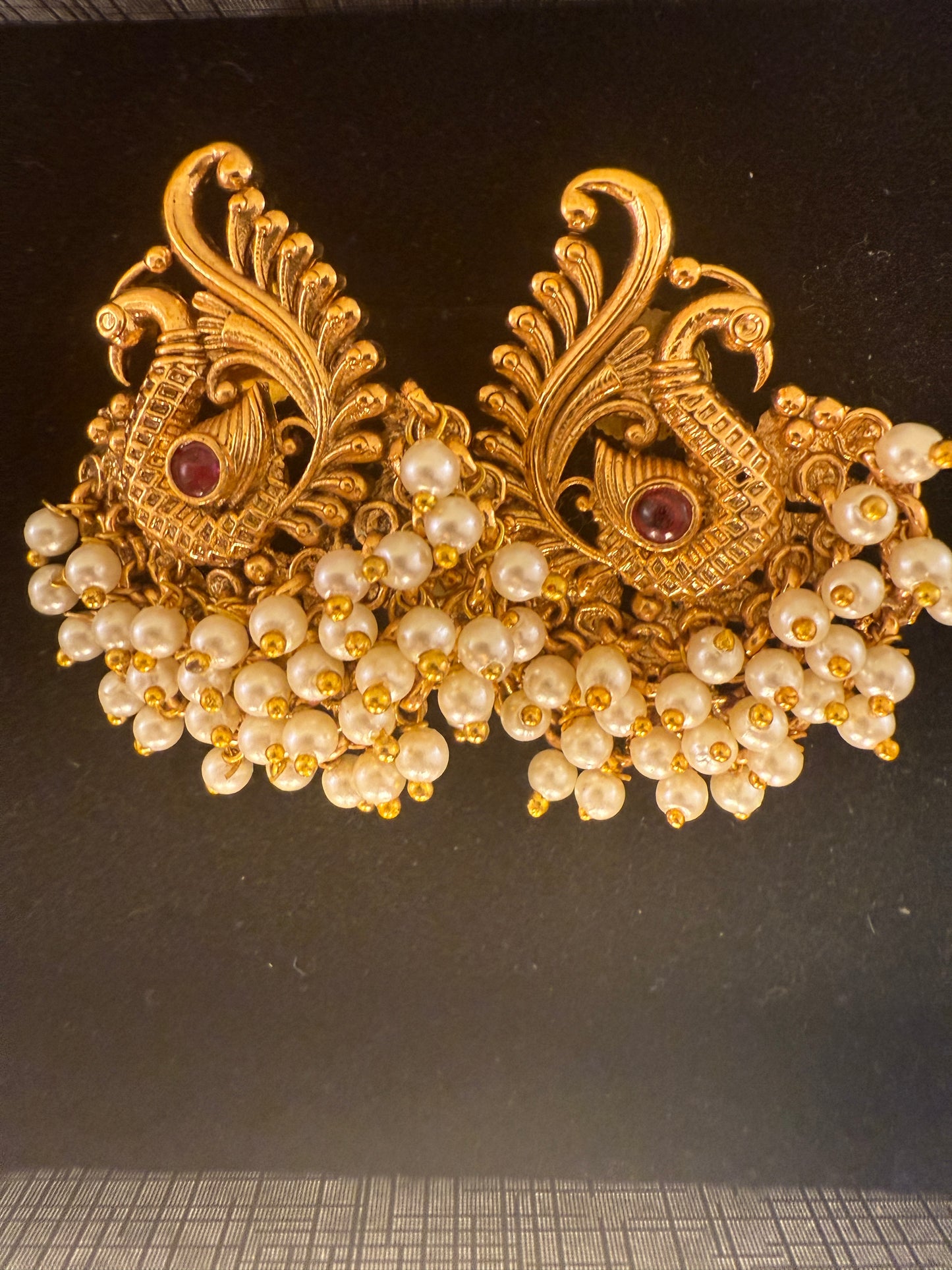 Hansini - swan pearl earrings