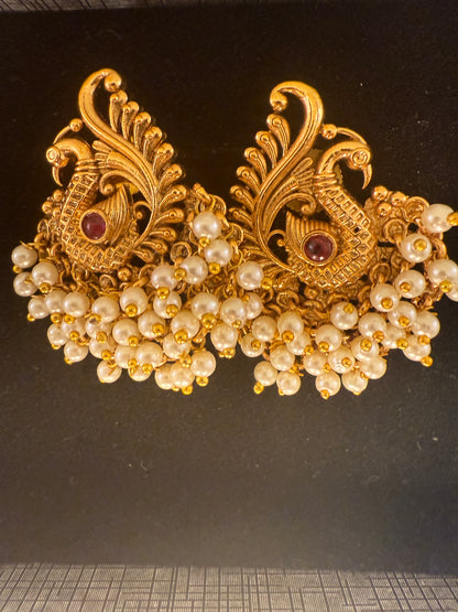 Hansini - swan pearl earrings