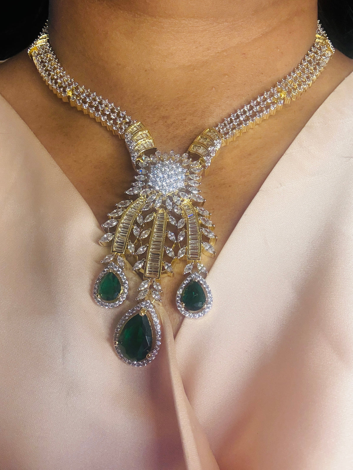 Green stone CZ next to real
