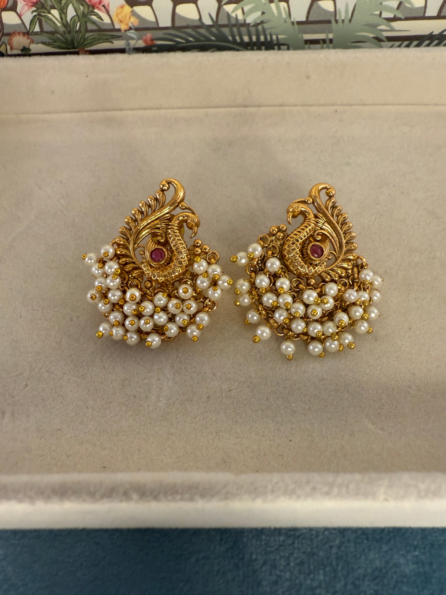 Hansini - swan pearl earrings